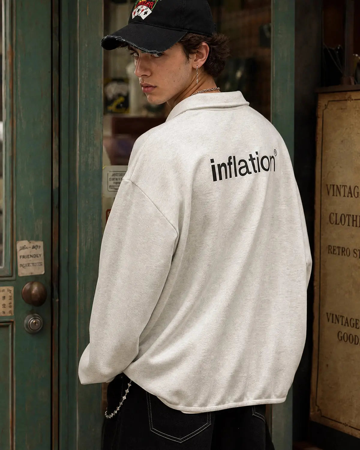 Flation Quarter Polo Sweatshirt featuring a classic collar, quarter zip, and casual streetwear style in neutral color.