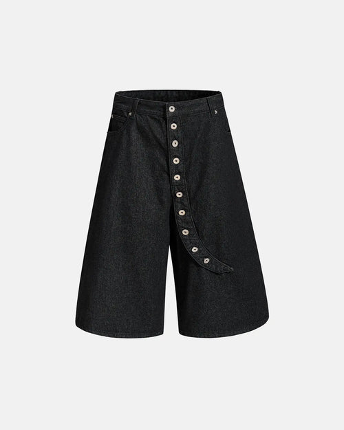 Asymmetric button raw denim jorts by Flation Streetwear, showing distressed raw denim fabric and unique button detailing.