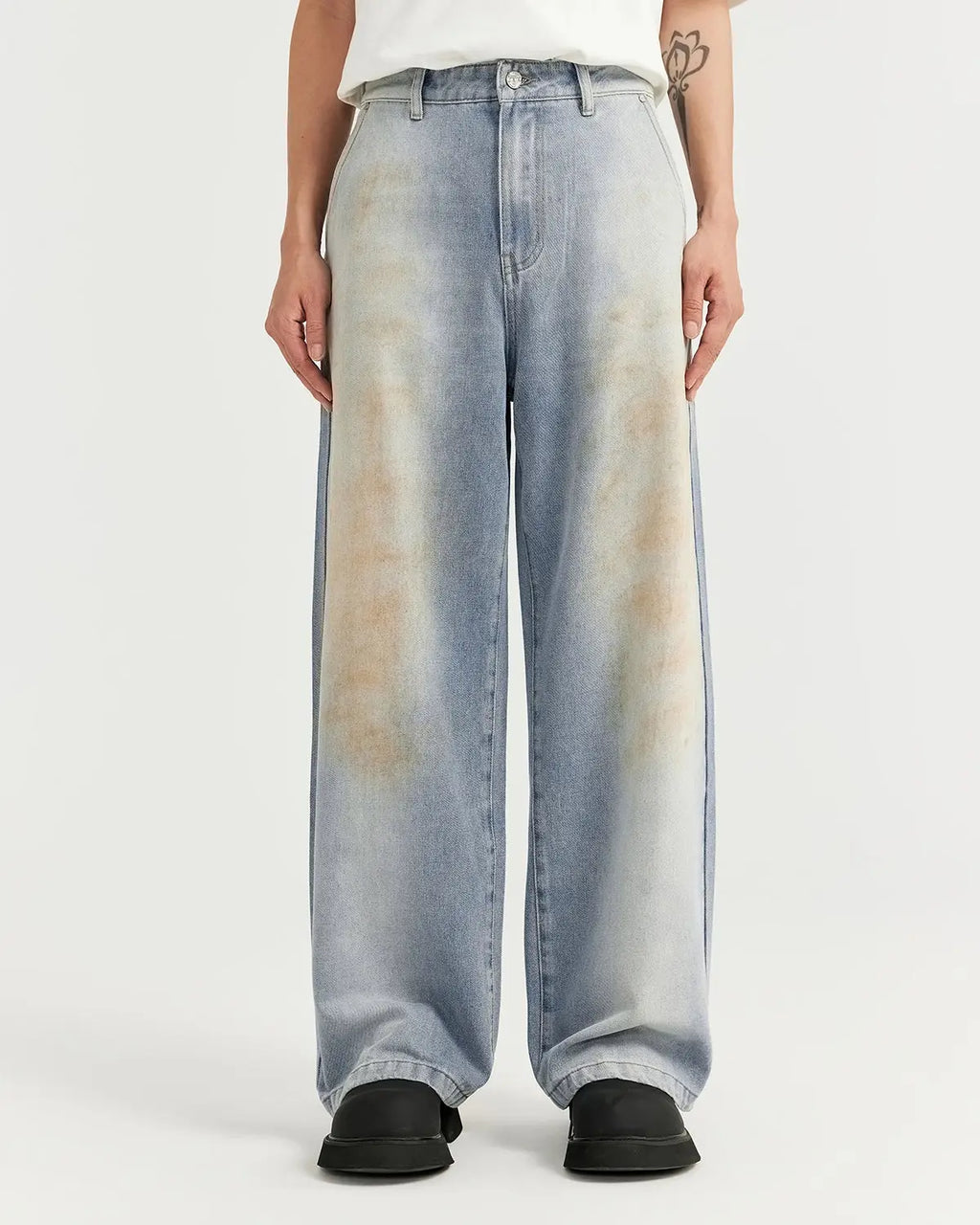 Mud washed baggy jeans by Flation Streetwear, featuring a relaxed fit and distressed denim design.