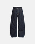 Raw blue deconstructed baggy jeans by INFLATION Streetwear with distressed details and relaxed fit, shown on a model.