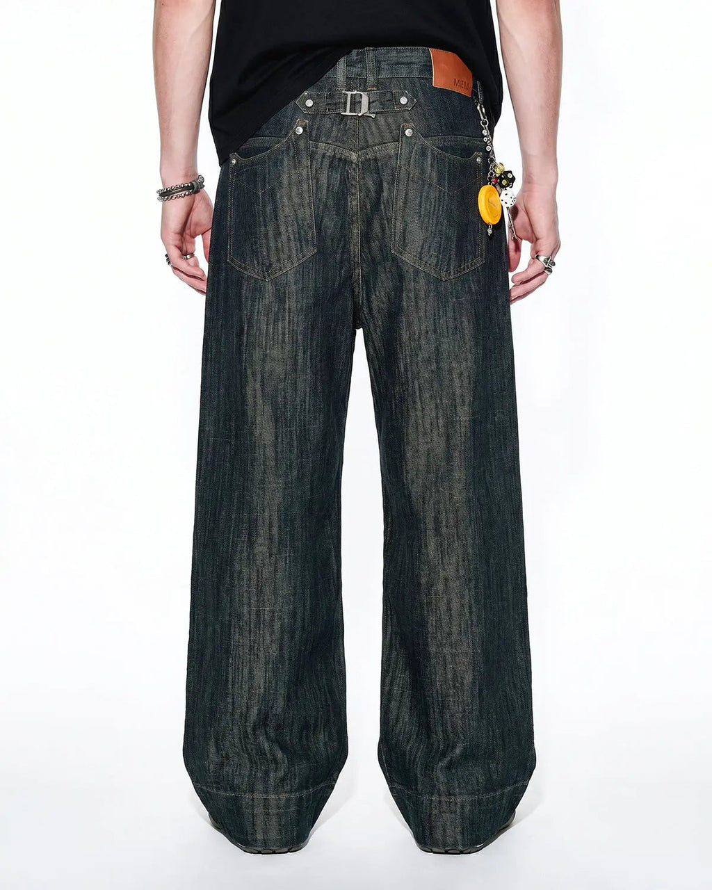 Flation Cinch Back Bamboo Weave Jeans showing fitted waist, tapered legs, and bamboo fabric texture in natural light.
