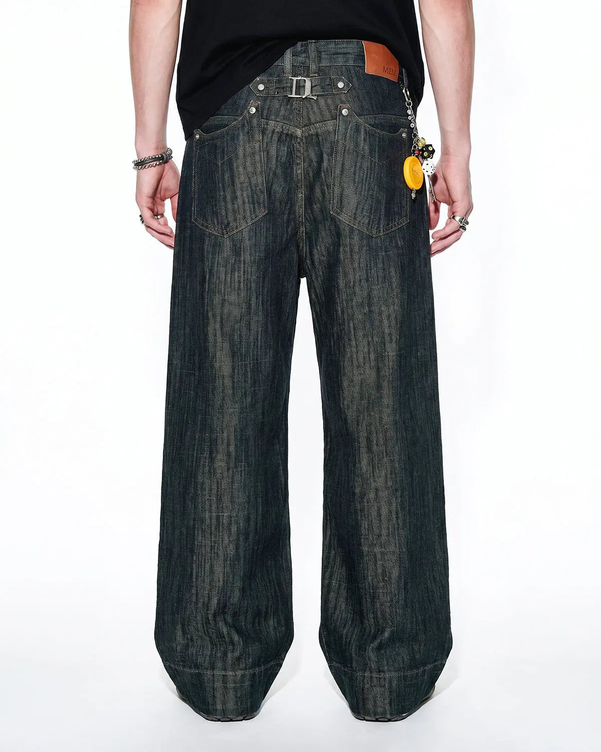 Flation Cinch Back Bamboo Weave Jeans showing fitted waist, tapered legs, and bamboo fabric texture in natural light.