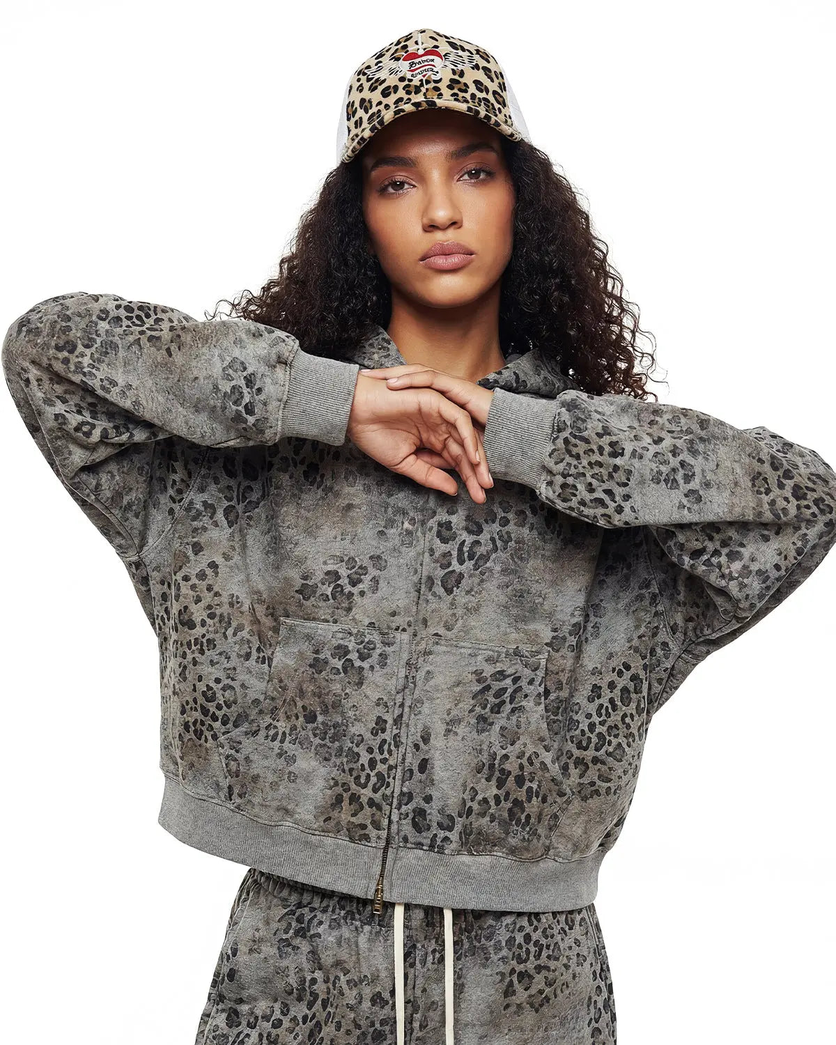 Leopard print boxy zip-up hoodie by INFLATION, featuring a casual streetwear style with a front zipper and bold animal pattern.