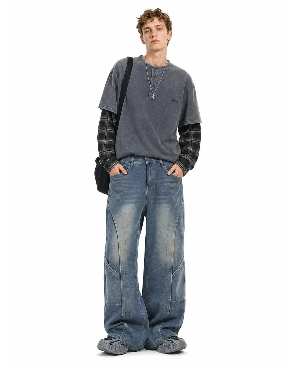 Deconstructed Baggy Straight-Leg Jeans by INFLATION with distressed details and relaxed fit, displayed on a neutral background.