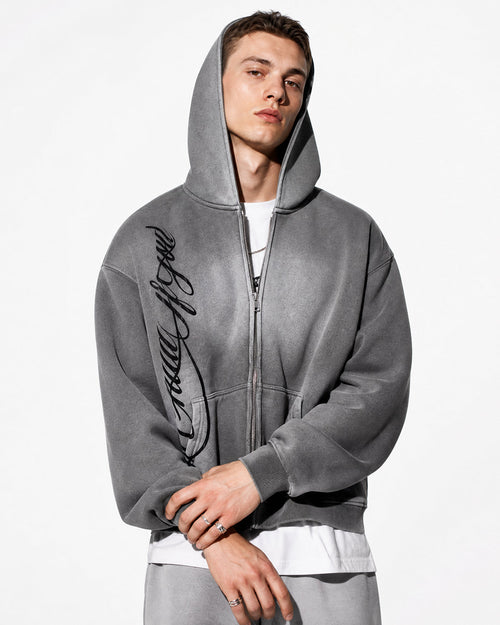 Flation acid wash zip-up hoodie with a front zipper, casual streetwear style, showing the textured, faded fabric and relaxed fit.