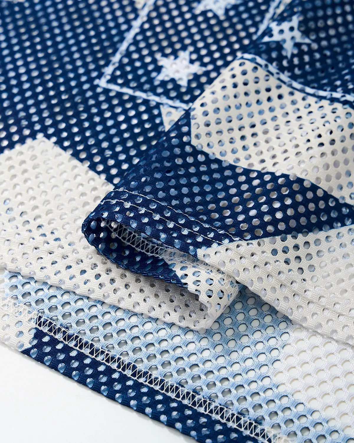 Star graphic oversized mesh jersey by INFLATION featuring a bold star design and transparent mesh fabric.