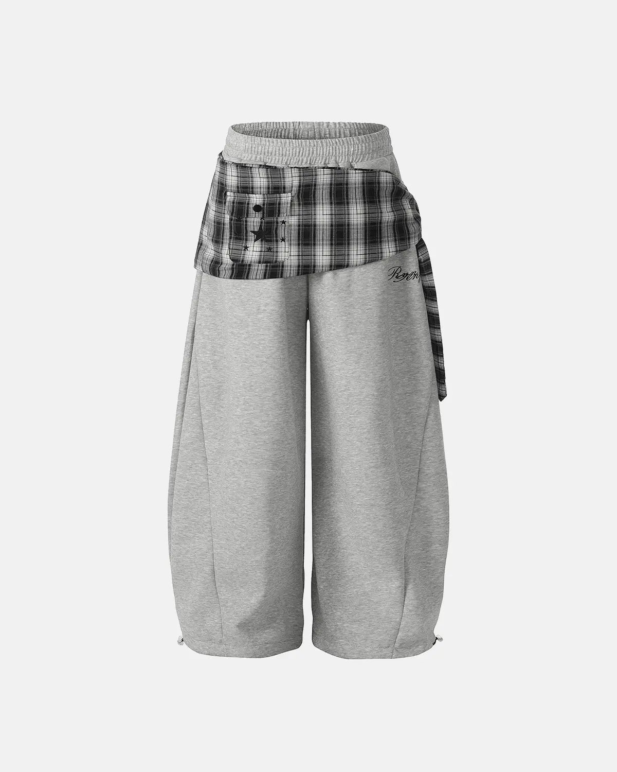 Inflation plaid layered baggy sweatpants with a relaxed fit, featuring a trendy streetwear style and layered fabric design.