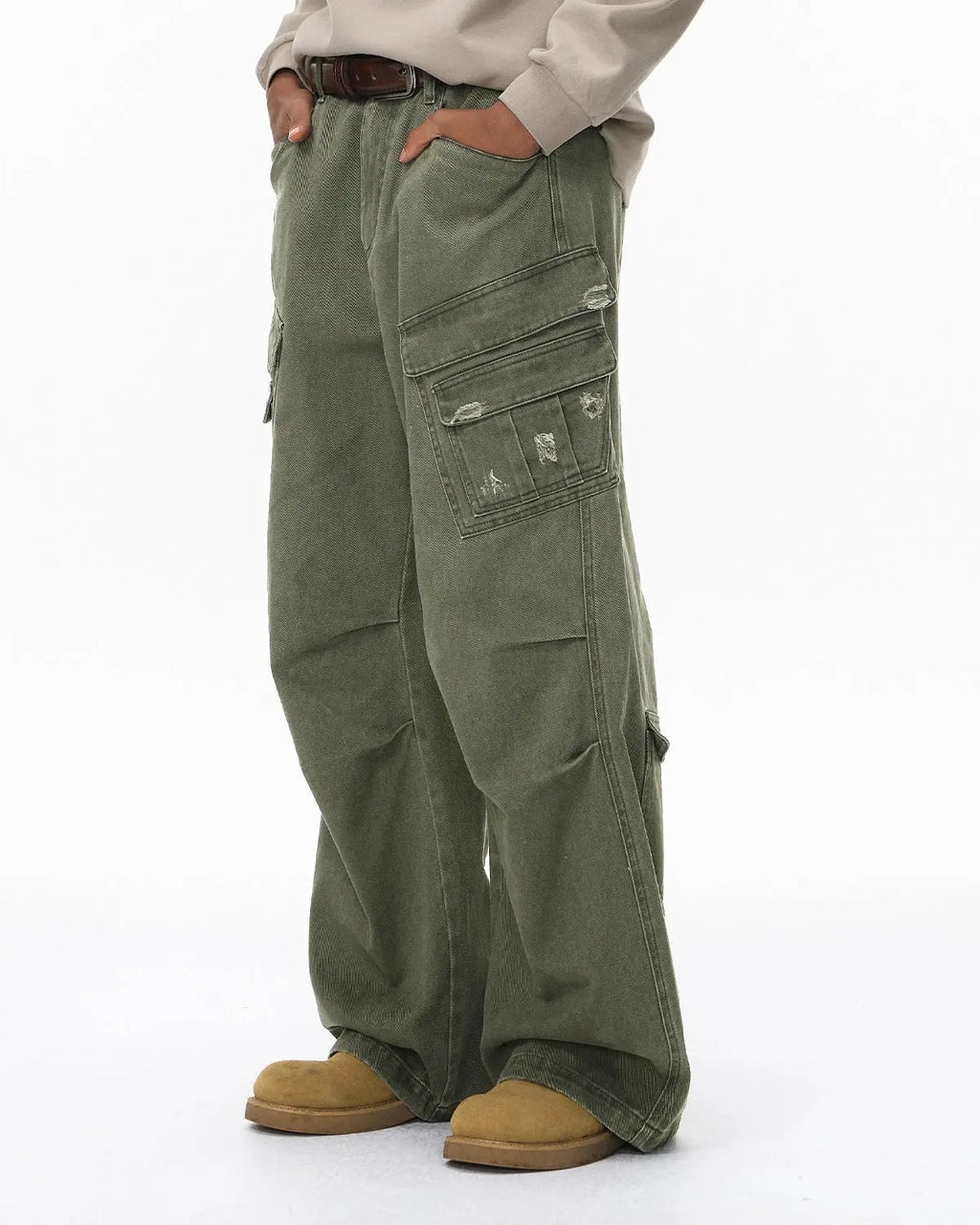 Inflation brand ripped cargo pants with distressed details, multiple cargo pockets, and a relaxed streetwear fit.
