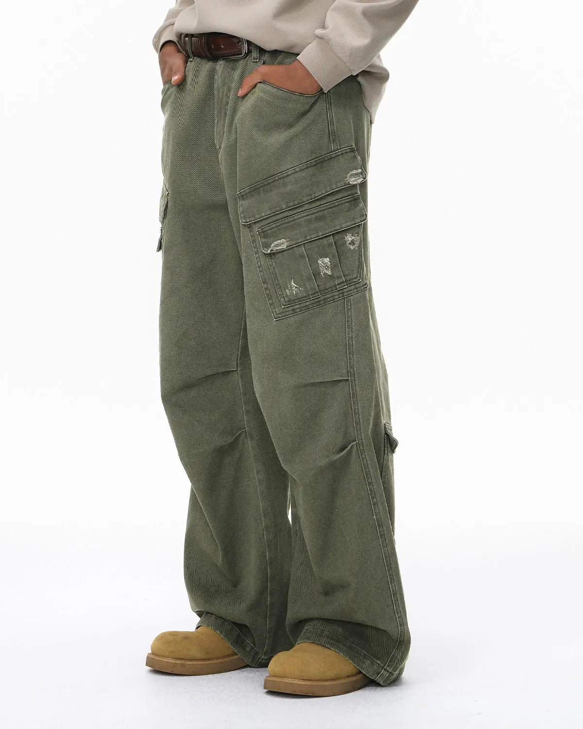 Inflation brand ripped cargo pants with distressed details, multiple cargo pockets, and a relaxed streetwear fit.