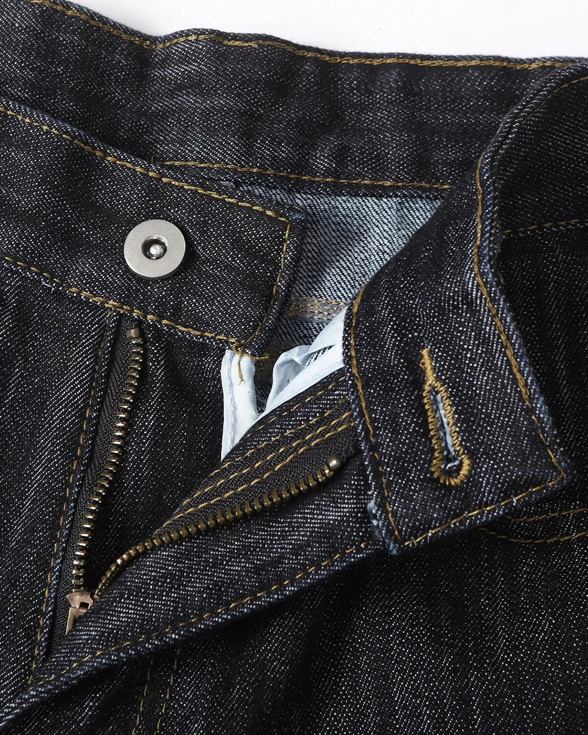 Embroidered raw baggy jeans from Inflation Streetwear with intricate embroidery, relaxed fit, and distressed denim details.