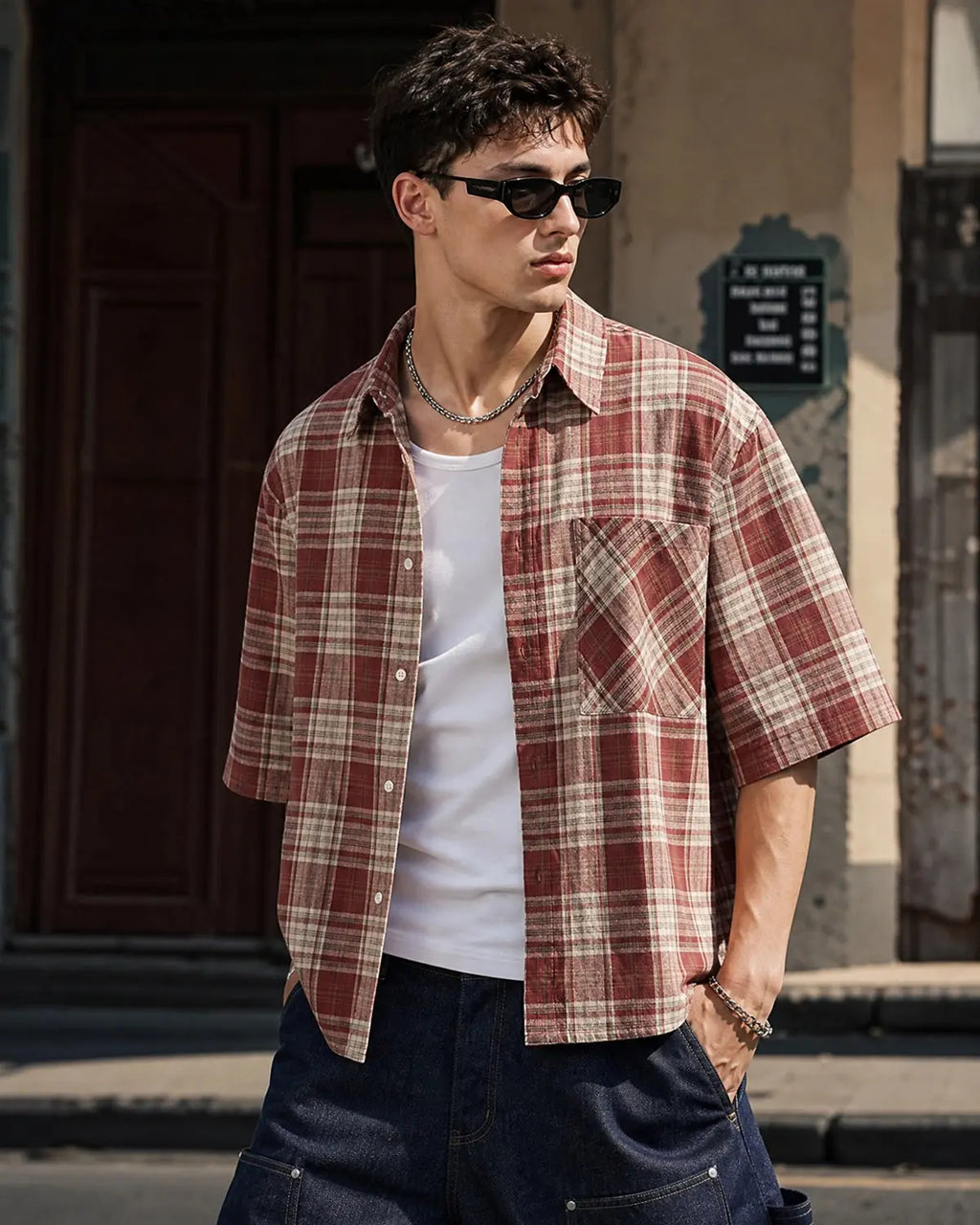 Flation boxy fit plaid shirt featuring a classic checkered pattern in red, black, and white, casual streetwear style.