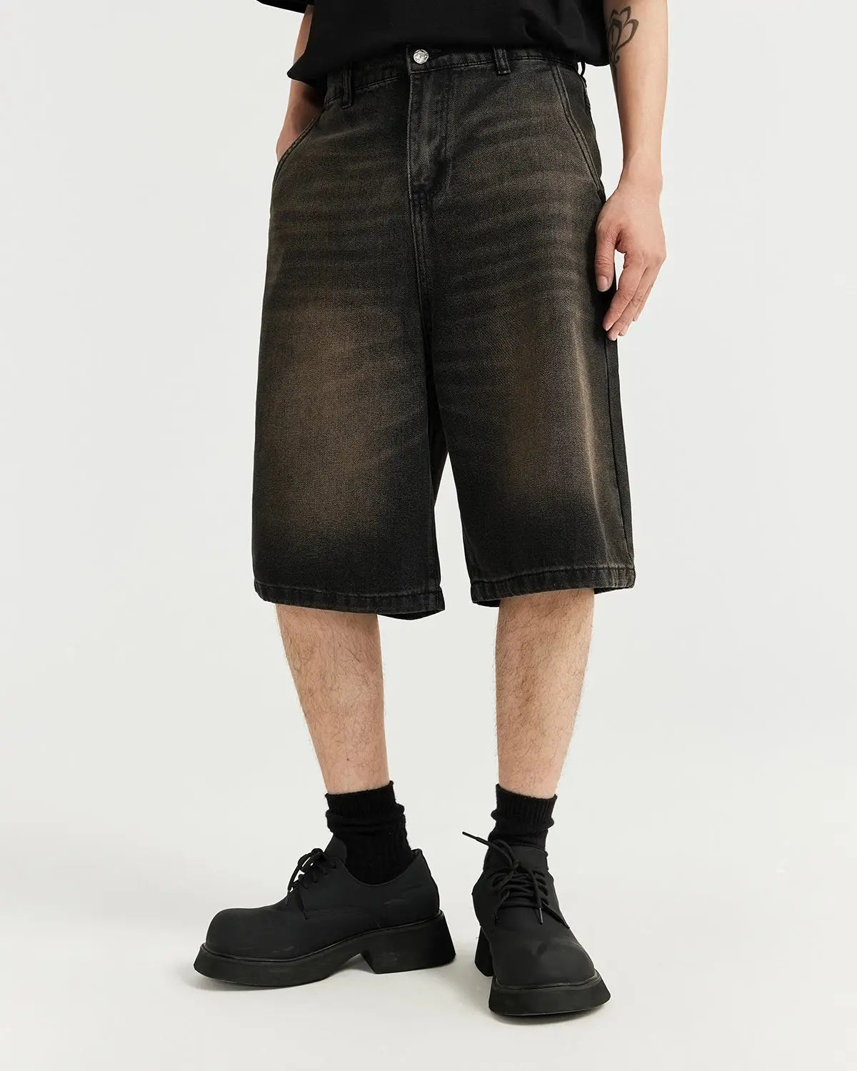 Retro washed jorts by INFLATION, denim shorts with a vintage distressed look, featuring frayed hems and classic jean details.
