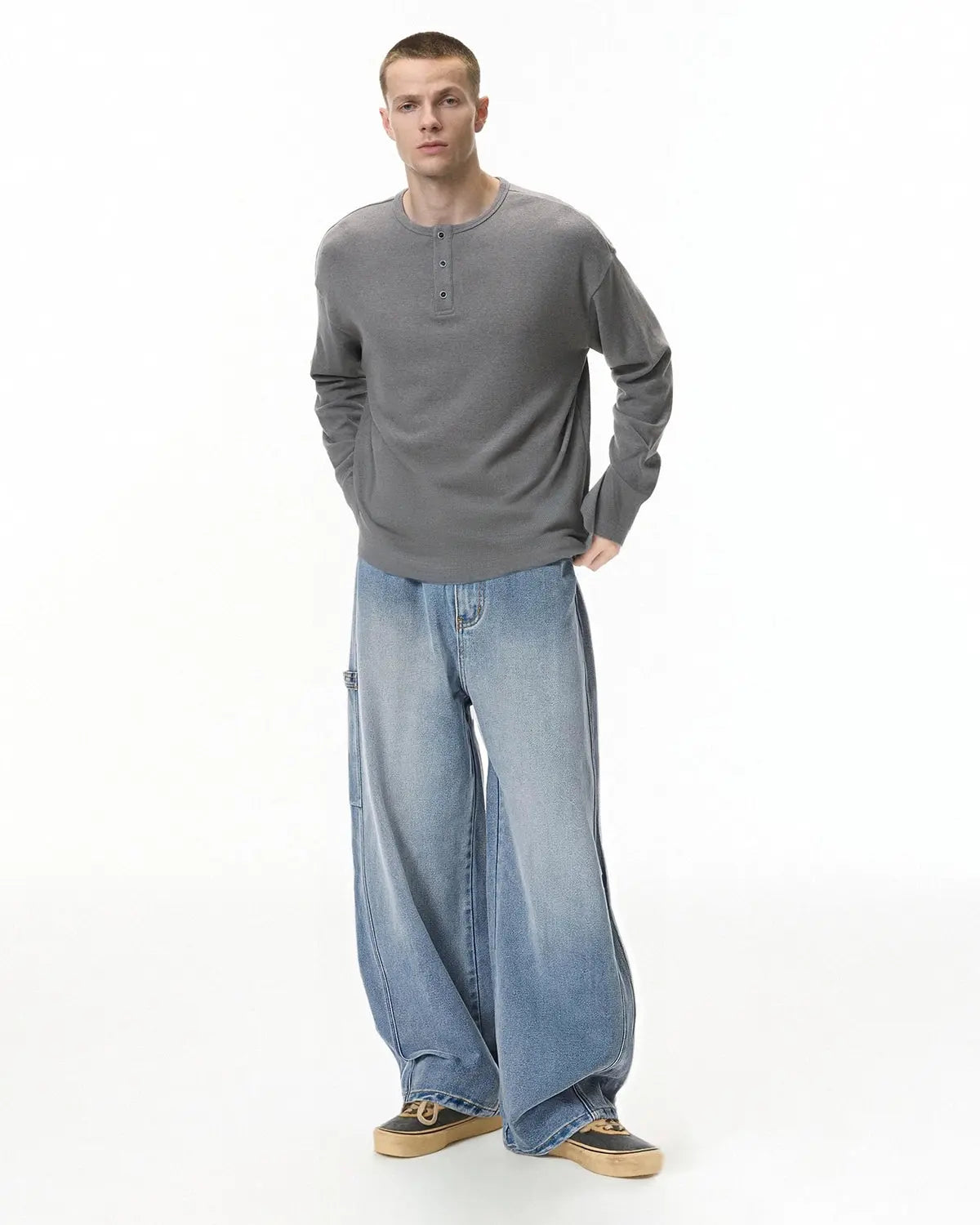 Distressed baggy cargo jeans by Flation Streetwear with a relaxed fit, featuring ripped details and multiple cargo pockets.