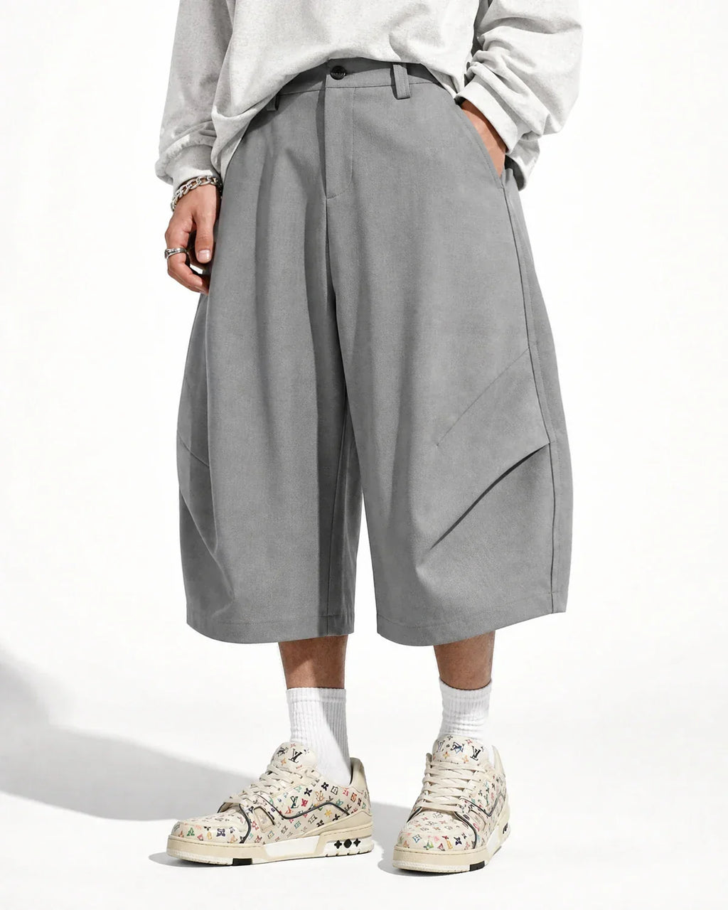 Flation Pleated Barrel Tailored Bermuda Shorts featuring a stylish, high-waisted design with a structured fit and pleated details.