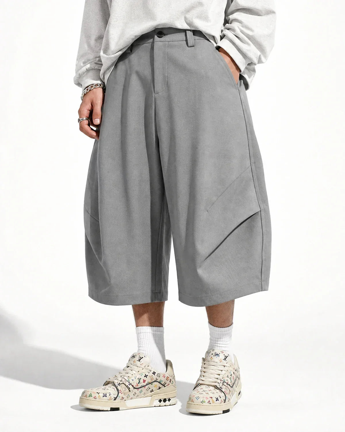Flation Pleated Barrel Tailored Bermuda Shorts featuring a stylish, high-waisted design with a structured fit and pleated details.