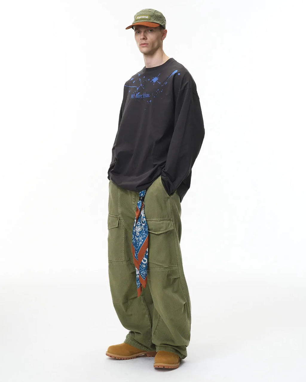 Flation streetwear cargo pants with multiple pockets, garment washed for a casual, rugged look, shown with relaxed fit and detailed pockets.