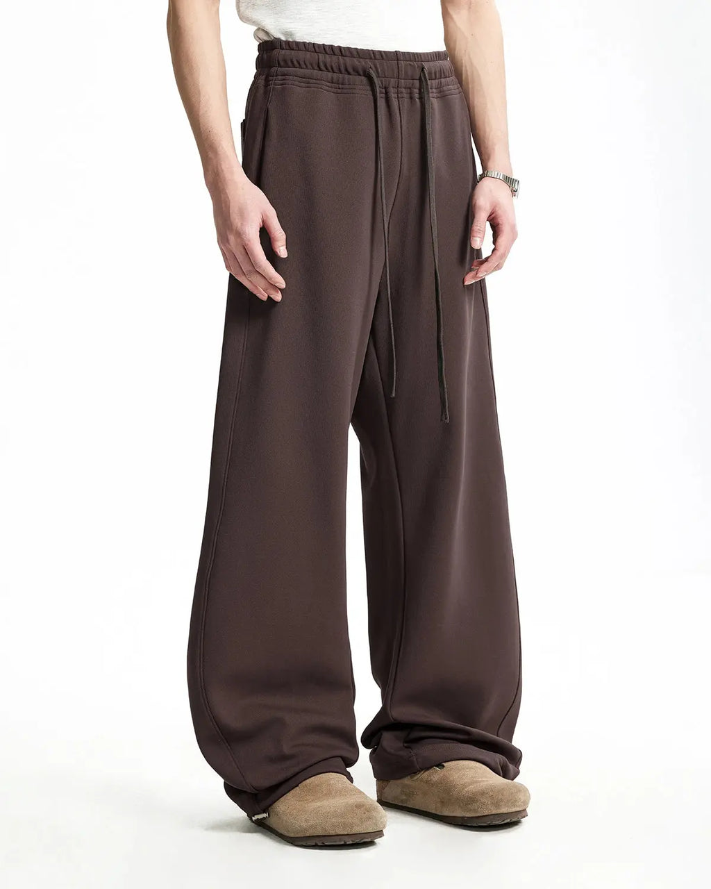 Grey baggy sweatpants by INFLATION with a relaxed fit, featuring an elastic waistband and casual style, shown on a model.