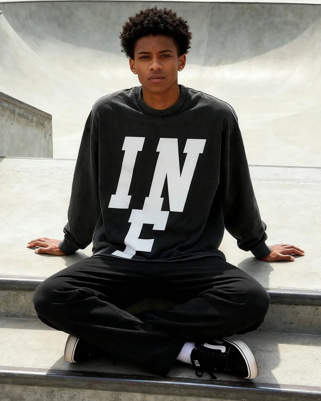 Inflation Streetwear reflective logo acid wash tee featuring a casual fit and distressed look with prominent brand logo design.