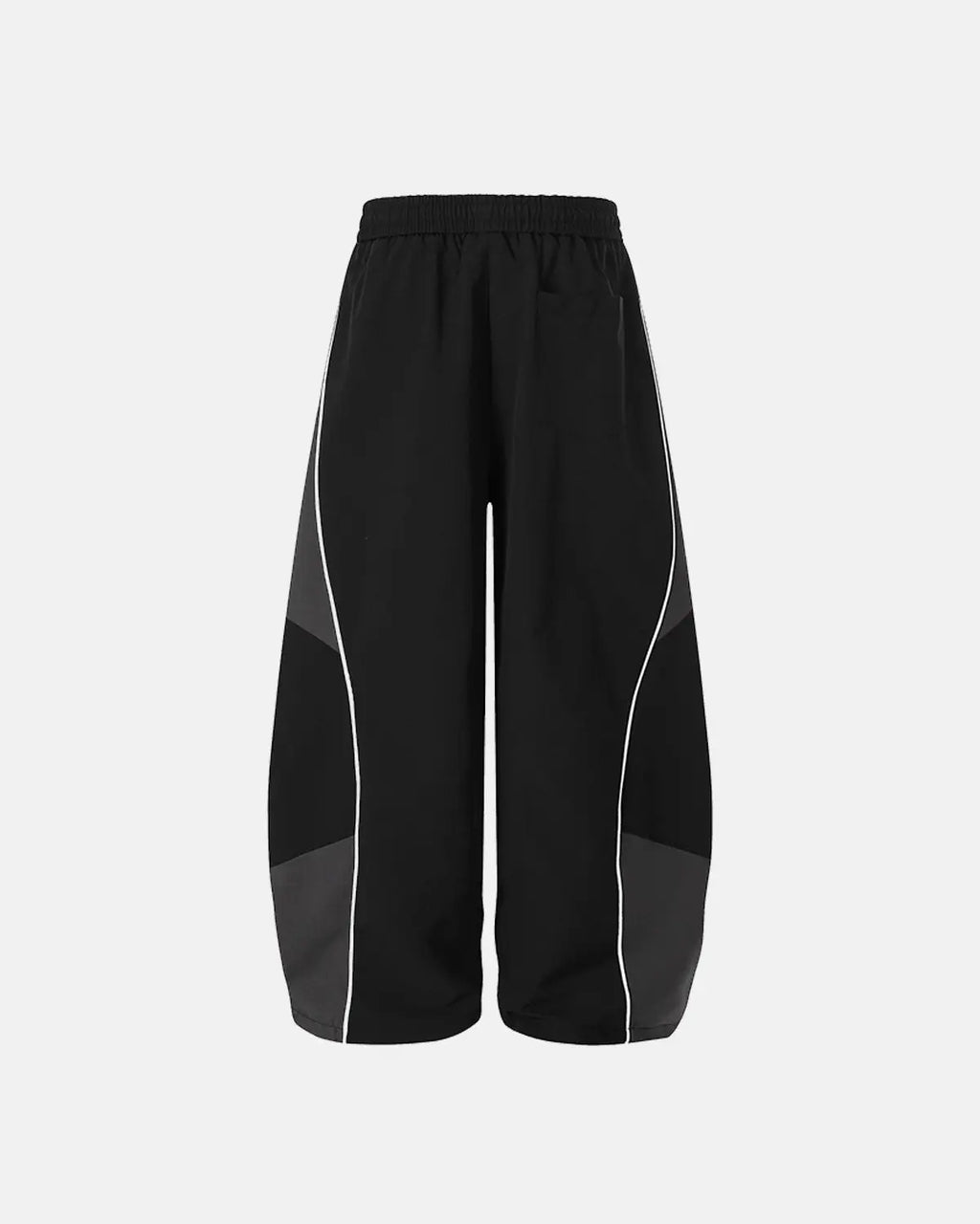 Inflation Streetwear contrast panel baggy track pants with black and white design, relaxed fit, and adjustable waistband.