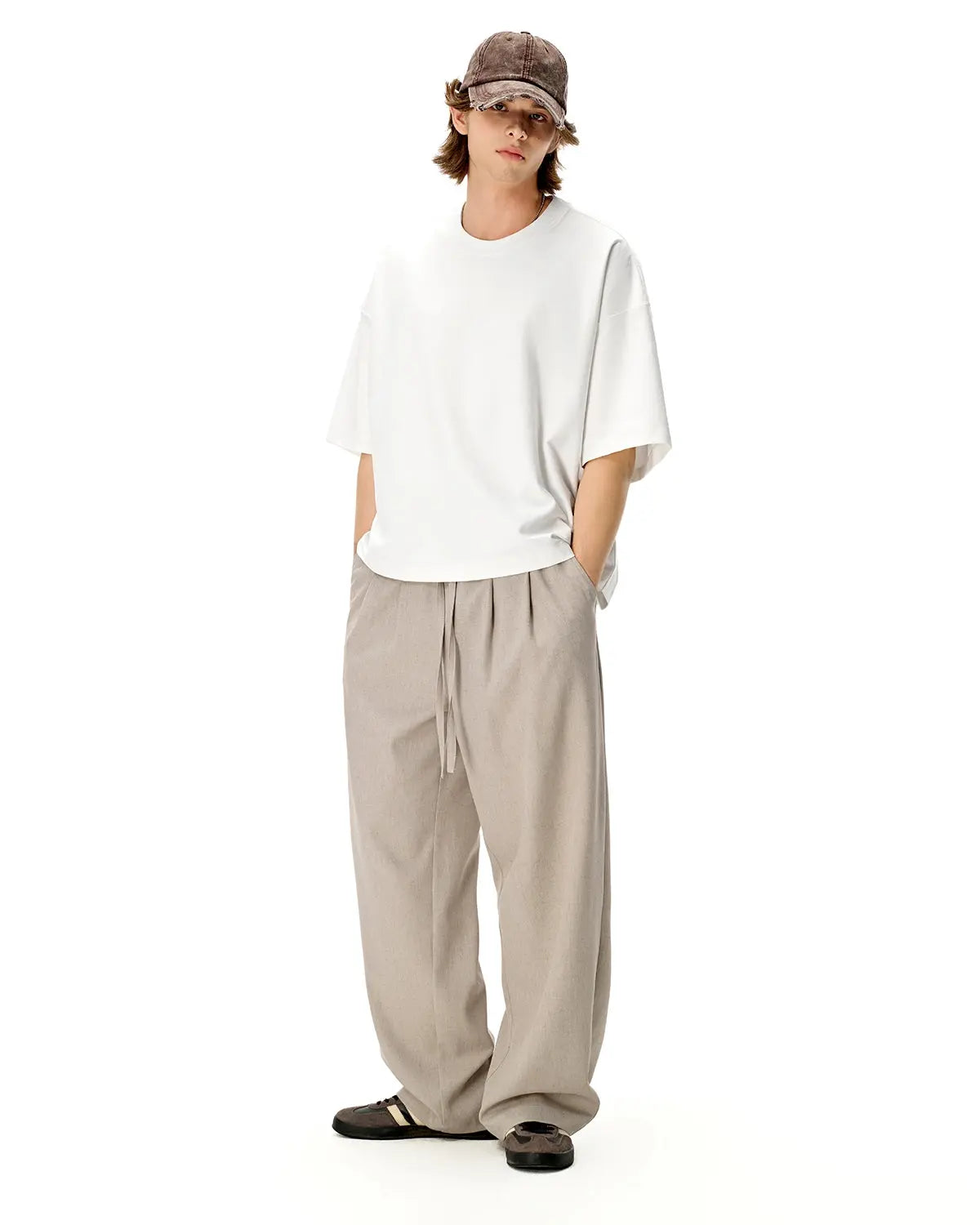 Blank oversized boxy T-shirt by Flation Streetwear, featuring a relaxed fit and minimal design, displayed on a hanger.