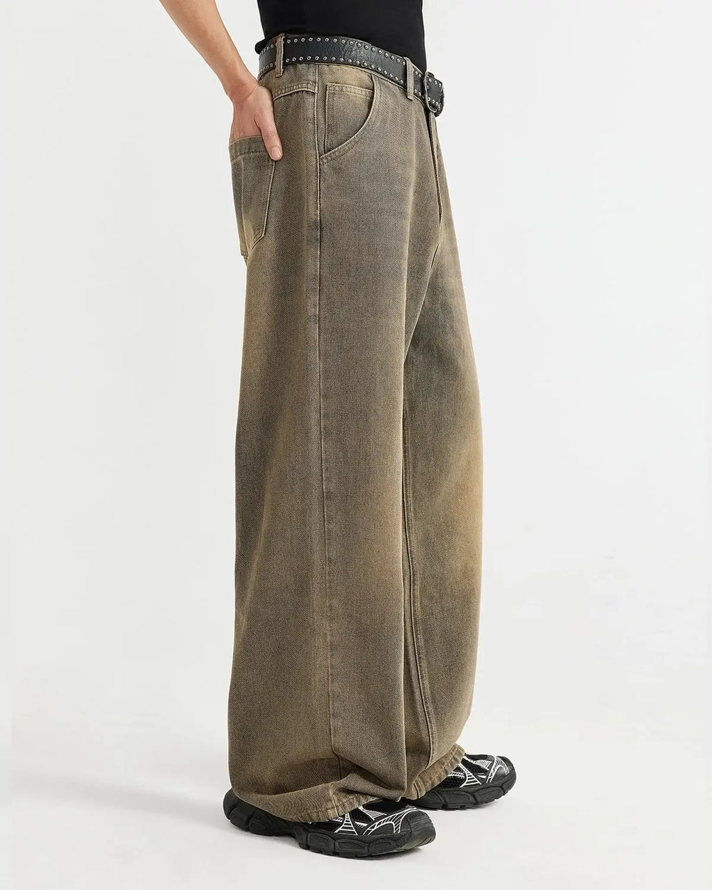 Brown acid wash baggy jeans by Flation featuring a relaxed fit, distressed details, and vintage-inspired streetwear style.