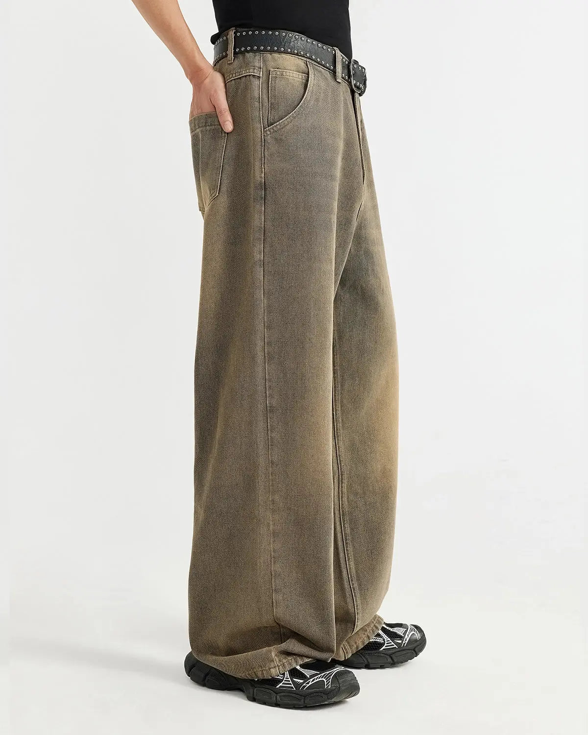 Brown acid wash baggy jeans by Flation featuring a relaxed fit, distressed details, and vintage-inspired streetwear style.