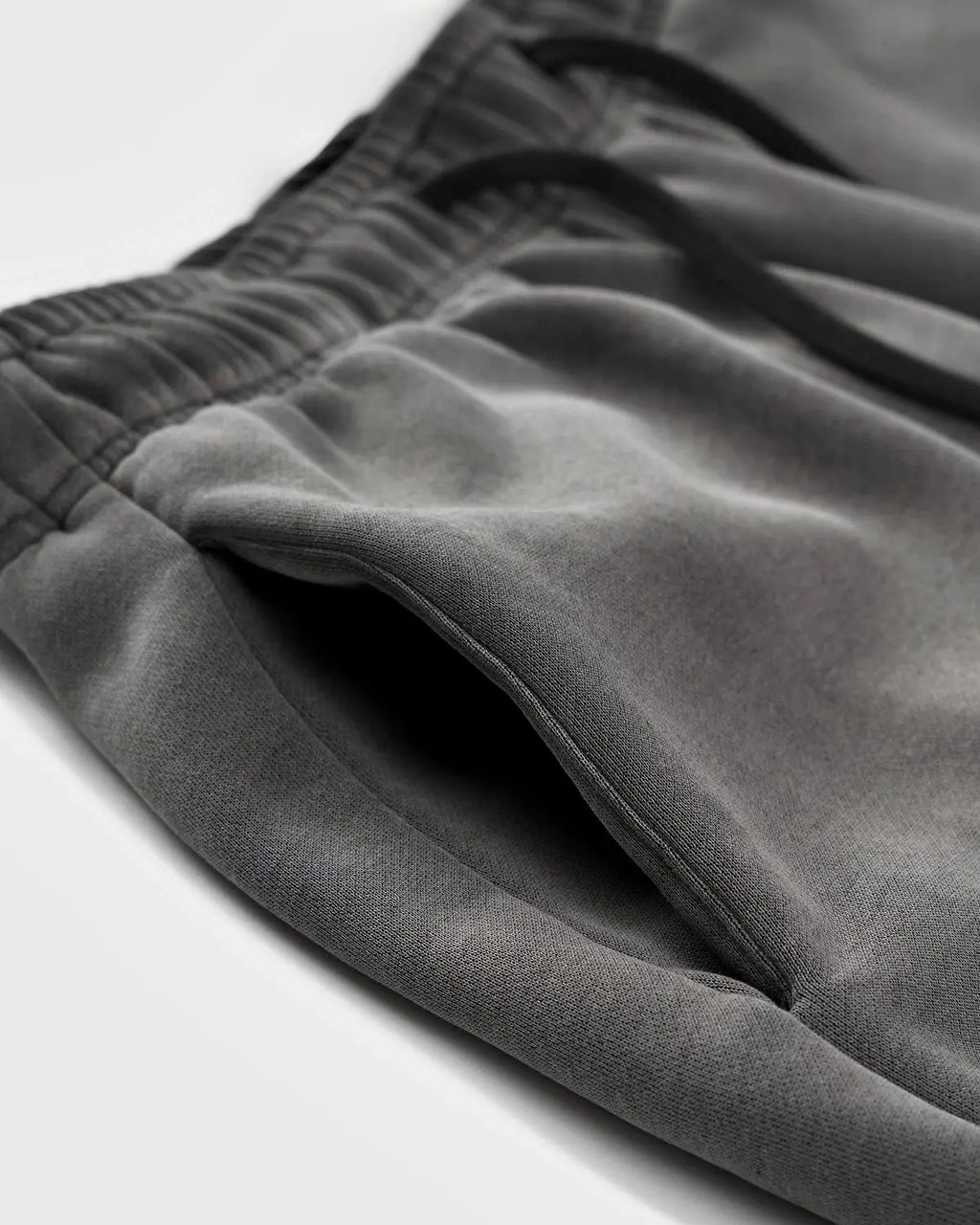 Acid washed Flation Streetwear sweatpants with relaxed fit, featuring distressed denim style and casual streetwear design.