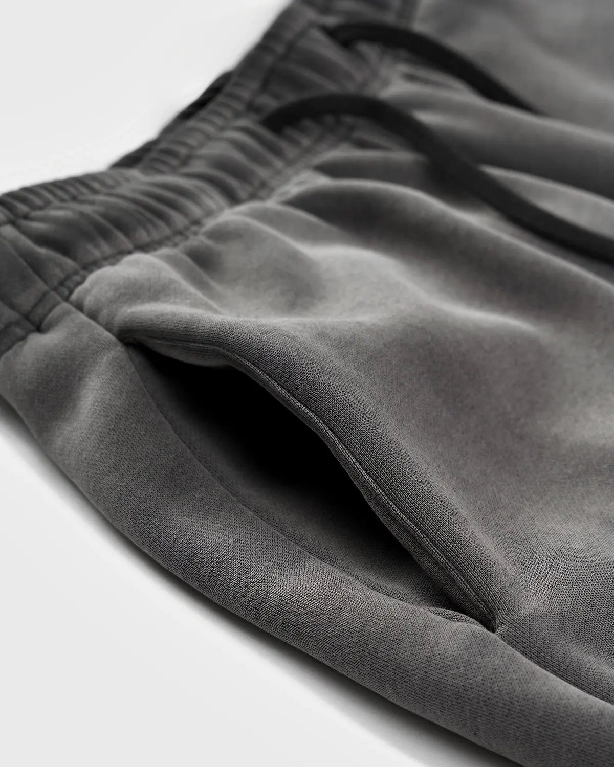 Acid washed Flation Streetwear sweatpants with relaxed fit, featuring distressed denim style and casual streetwear design.