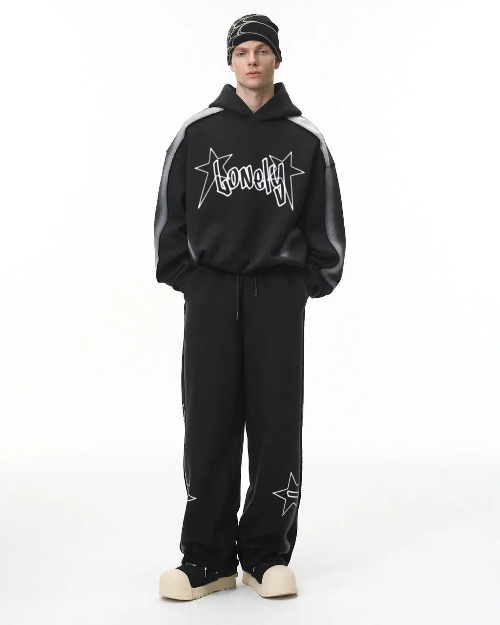 Flation graffiti sweatpants with colorful stitching spray paint design, streetwear style, relaxed fit, casual urban clothing.
