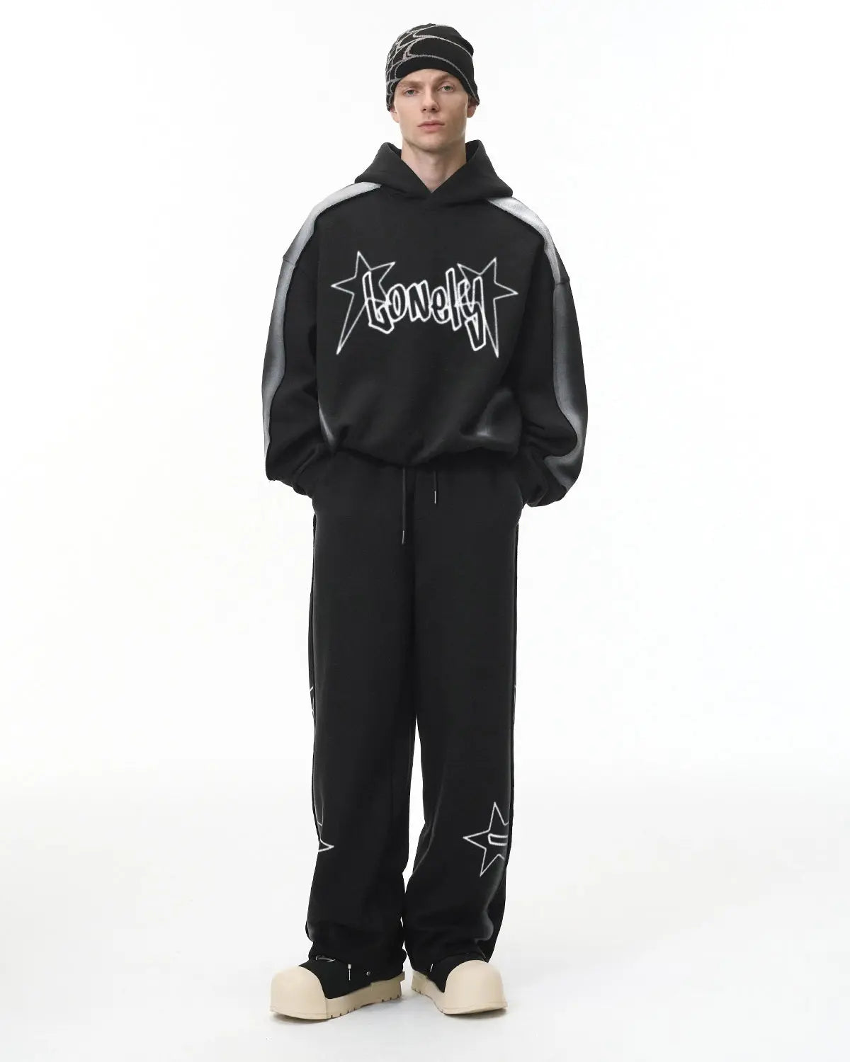Flation graffiti sweatpants with colorful stitching spray paint design, streetwear style, relaxed fit, casual urban clothing.