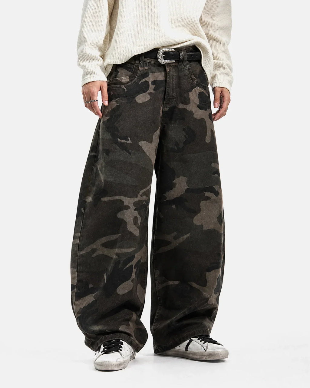 Inflation Streetwear studded camo barrel jeans, casual pants with metal stud accents and a rugged camouflage pattern.