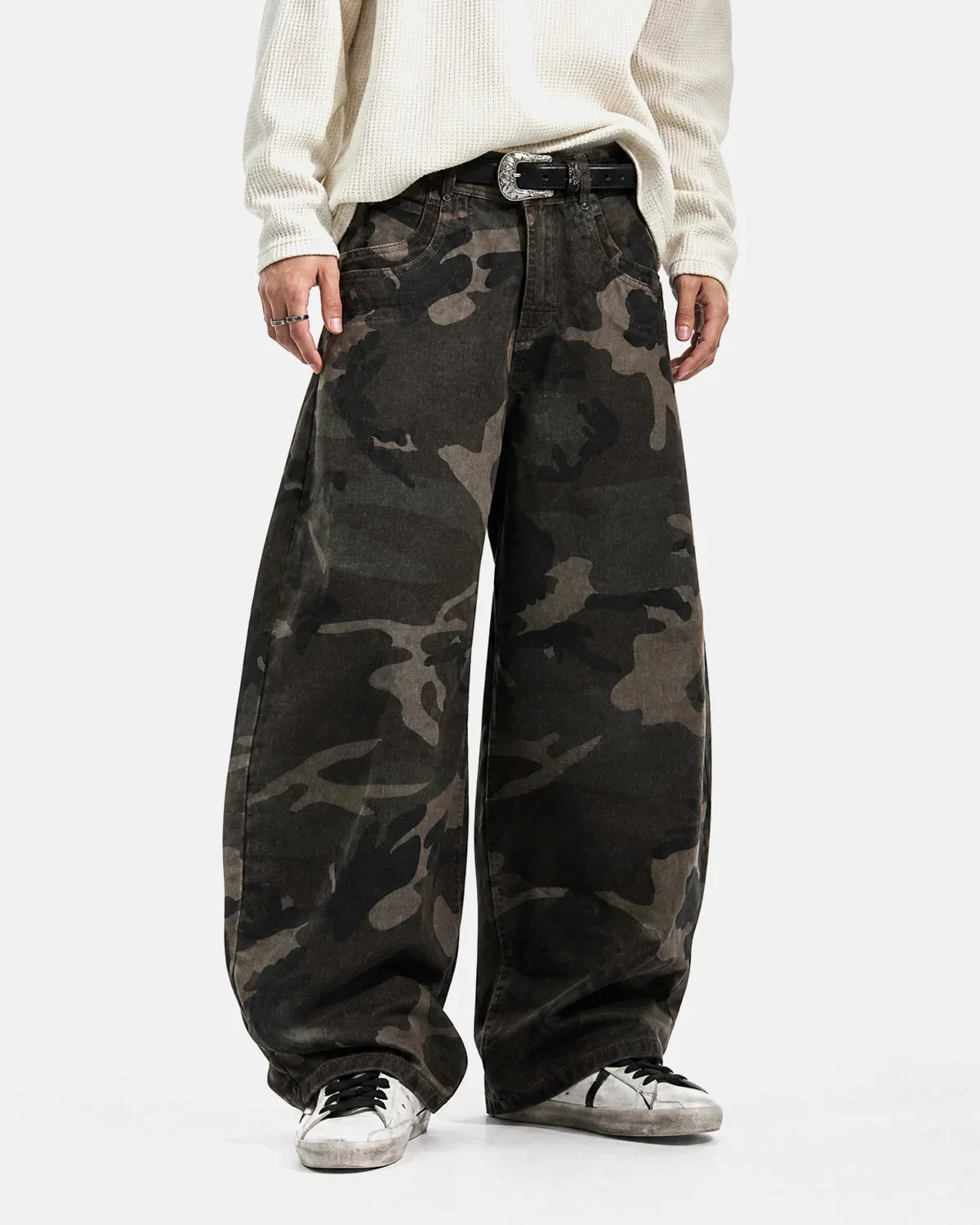 Inflation Streetwear studded camo barrel jeans, casual pants with metal stud accents and a rugged camouflage pattern.