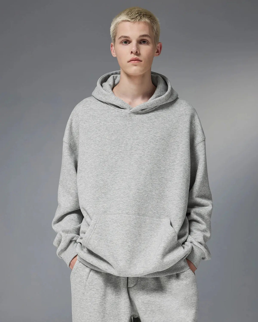 INFLATION Premium Thermal Oversized Hoodie in gray, showing the soft, thick fabric and relaxed fit with hood and front pocket.