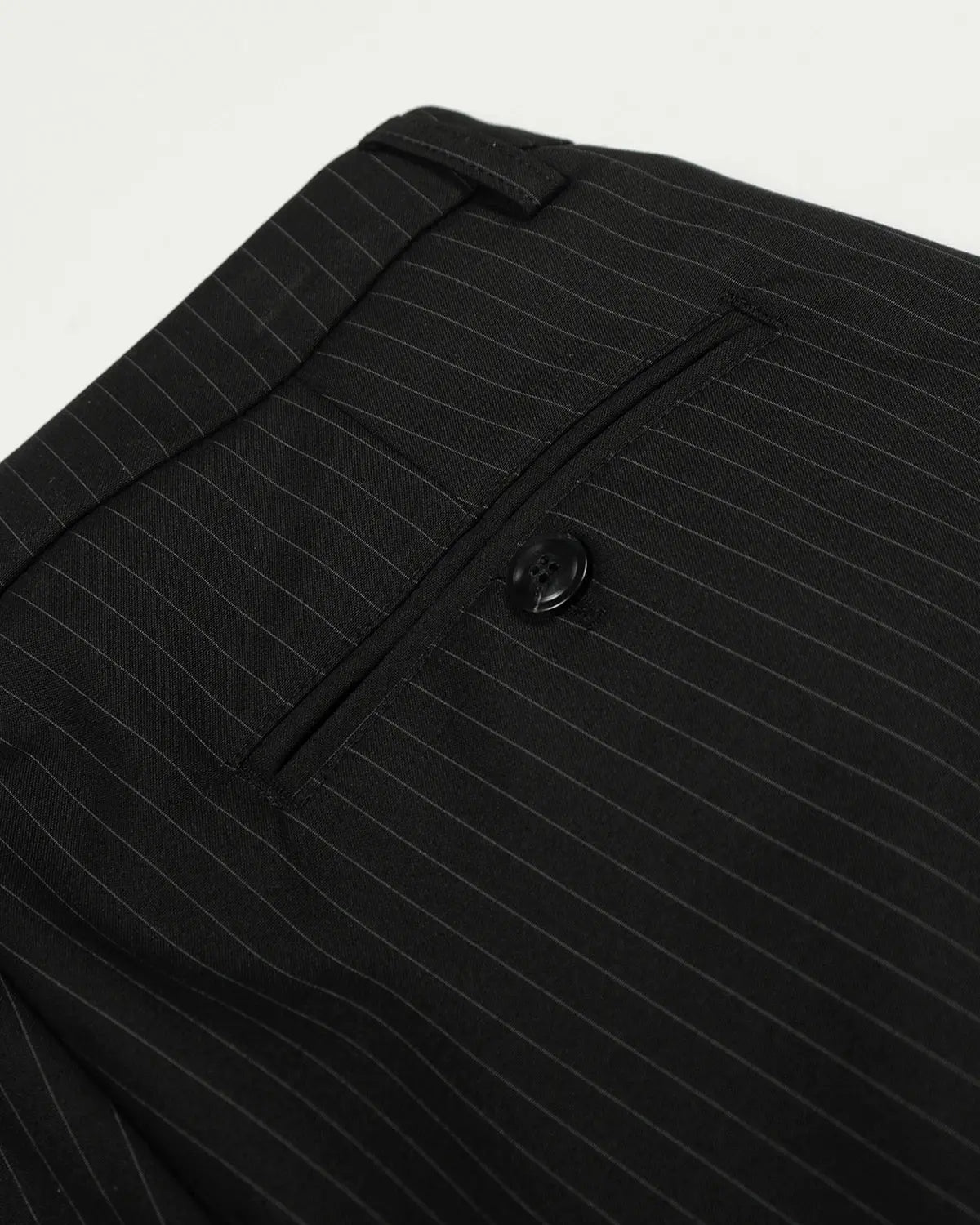 Black striped barrel suit pants by INFLATION Streetwear, featuring a relaxed fit and bold striped pattern, shown on a neutral background.