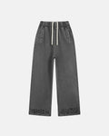 Ripped acid wash sweatpants from Flation Streetwear featuring distressed details and a relaxed fit on soft, casual fabric.