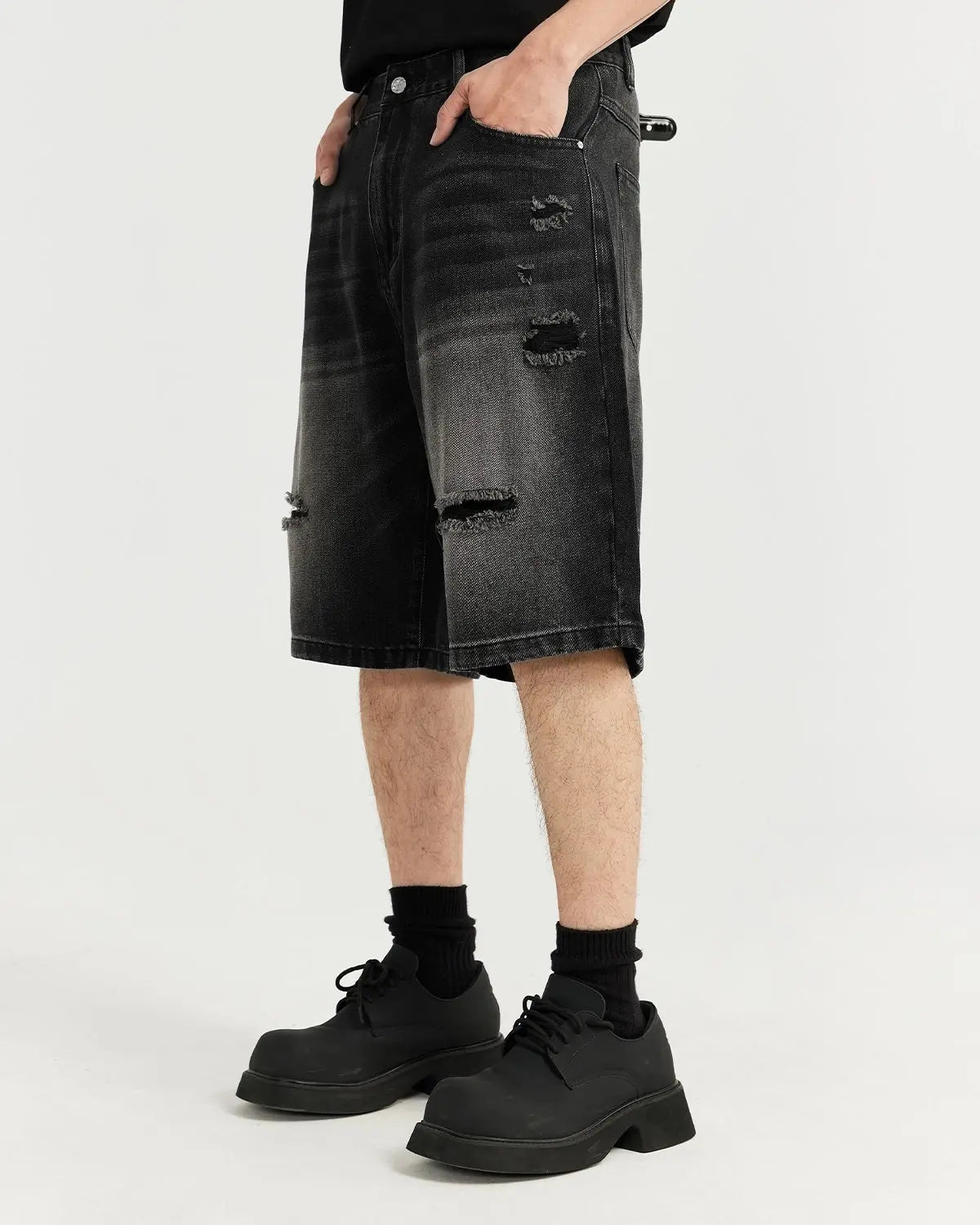 Vintage ripped washed Flation streetwear jorts with distressed denim and frayed hem, styled for casual summer wear.