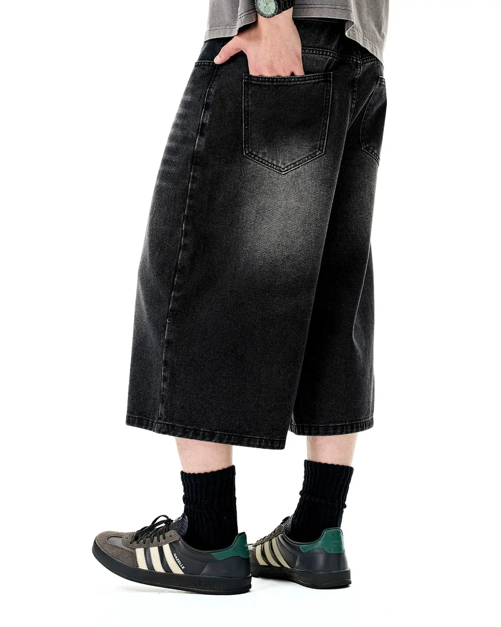 Washed baggy longline jorts pants by Flation Streetwear with distressed denim and relaxed fit, styled with casual streetwear look.