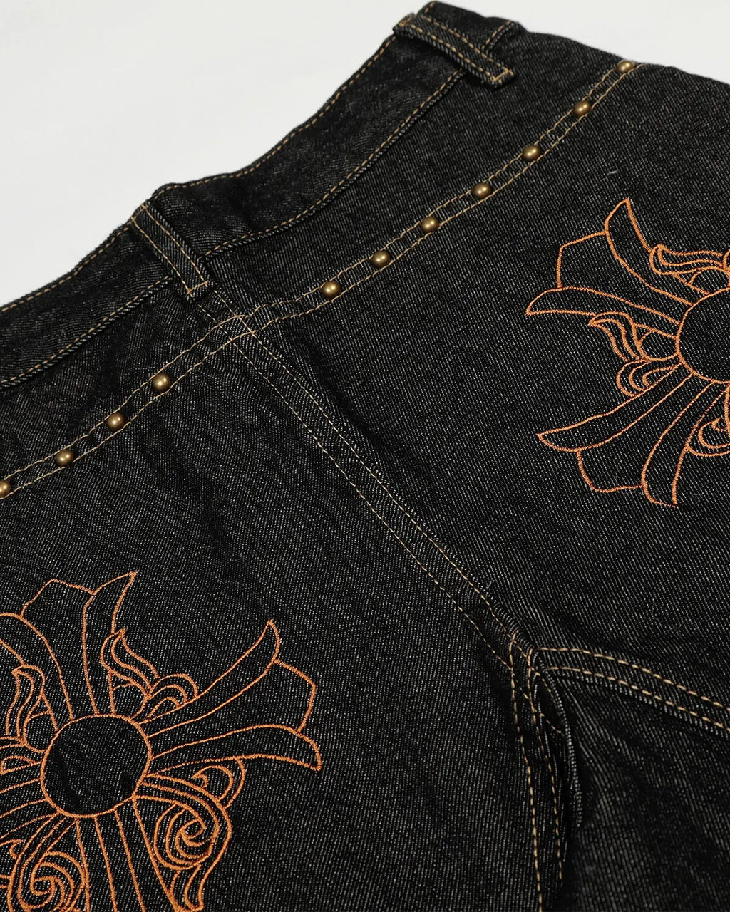 Dark blue Gothic Cross embroidery on stylish barrel jeans from INFLATION Streetwear, featuring detailed gothic cross design.