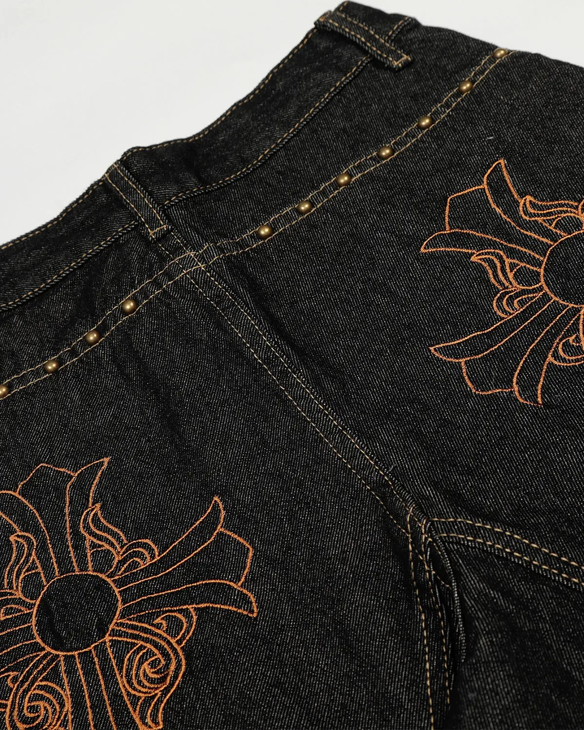 Dark blue Gothic Cross embroidery on stylish barrel jeans from INFLATION Streetwear, featuring detailed gothic cross design.
