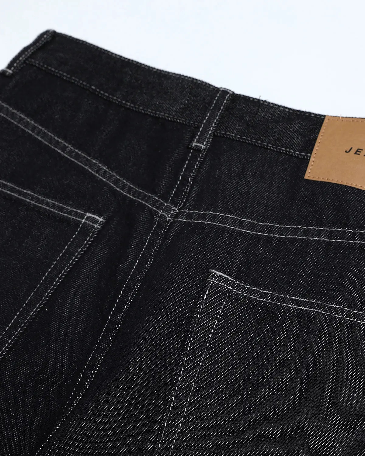Inflation Studded Rhinestone Baggy Denim Jeans with embellishments and distressed details, streetwear style, front view.