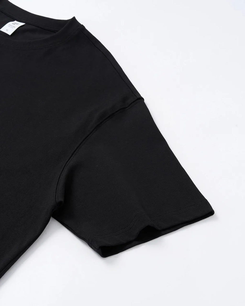 Inflation Streetwear Script Graphic Oversized T-Shirt in black with bold white text design on front, relaxed fit casual style.