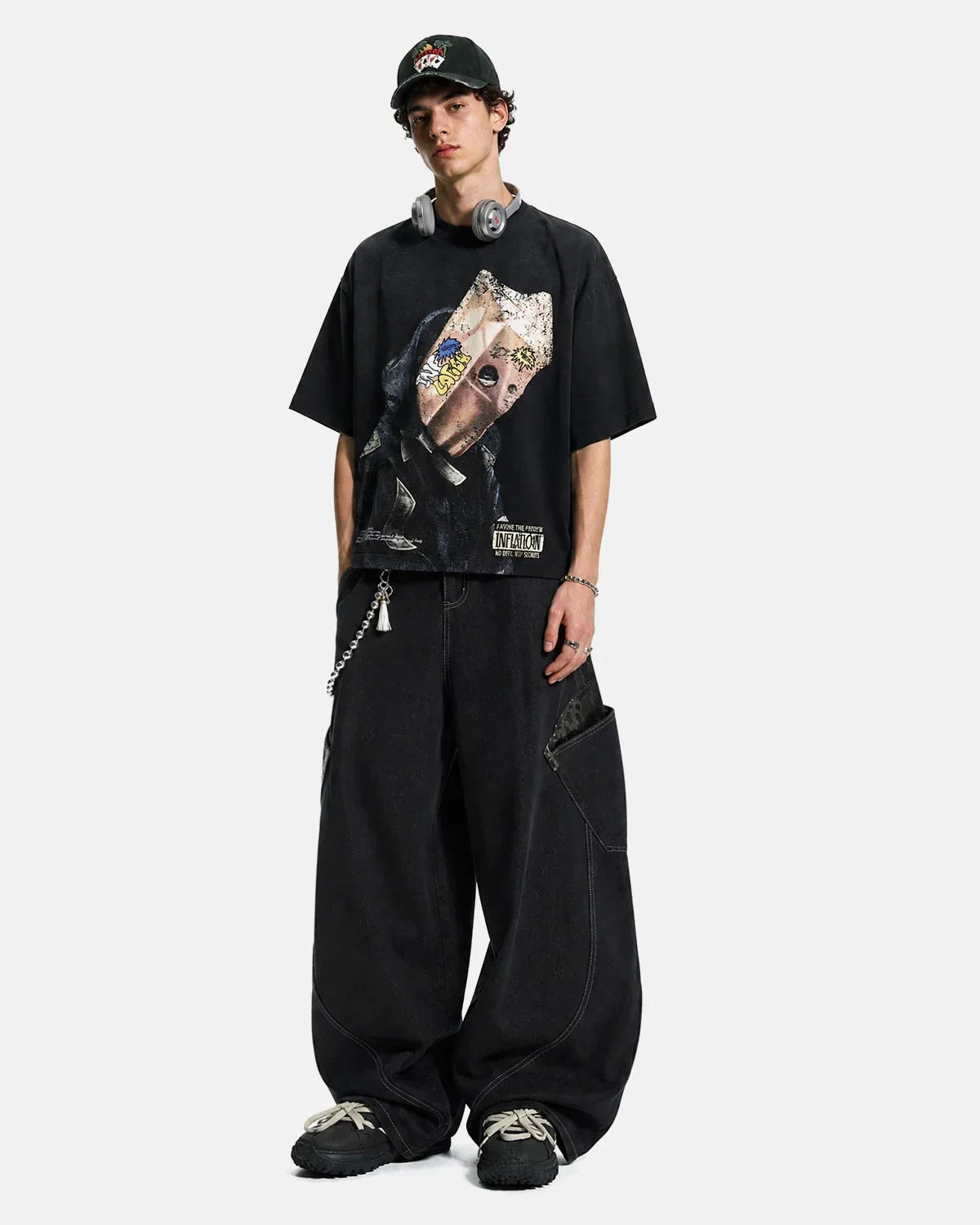 Washed boxy graphic tee from INFLATION Streetwear featuring bold print on soft, vintage-style cotton fabric.