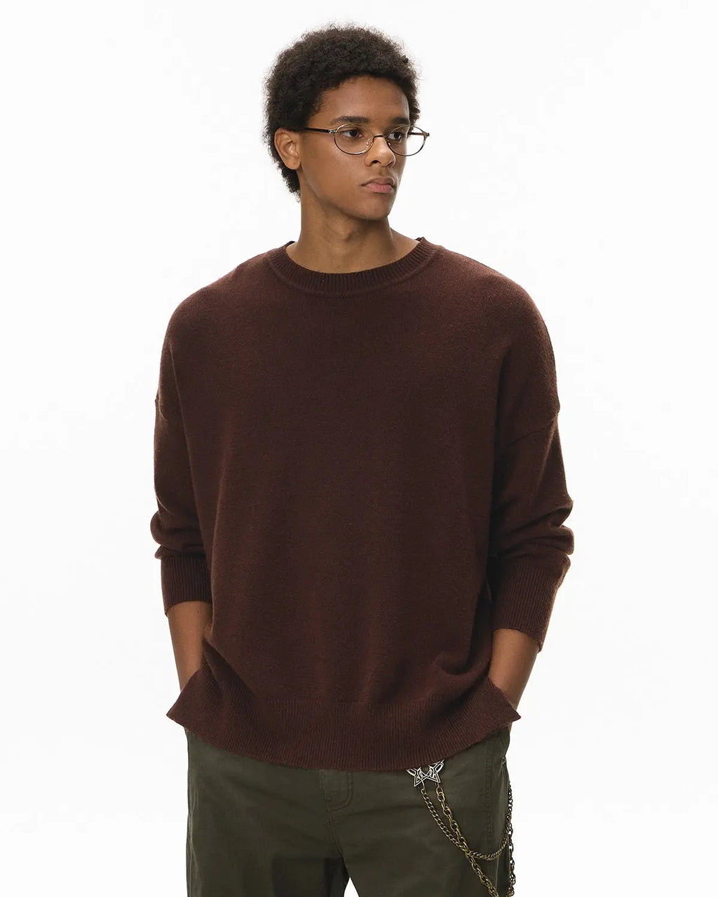 Inflation Streetwear crew neck knit sweater in neutral color, close-up showing soft fabric and classic fit.