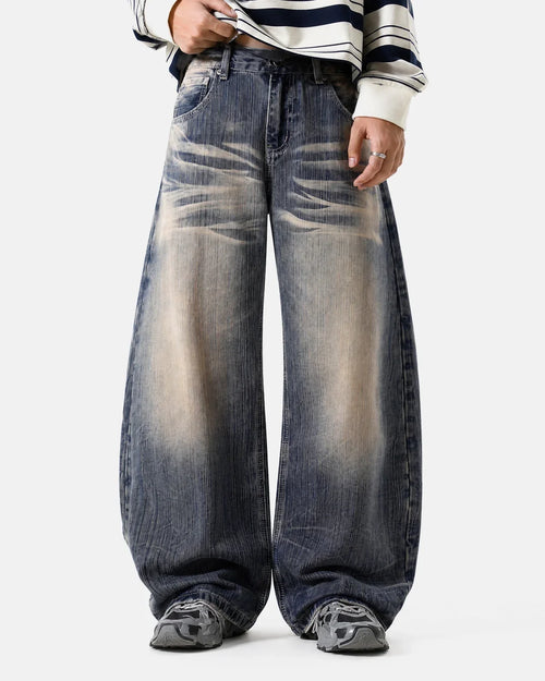 Bamboo weave Dirty Wash Barrel Jeans by Flation Streetwear featuring distressed denim and relaxed fit style.