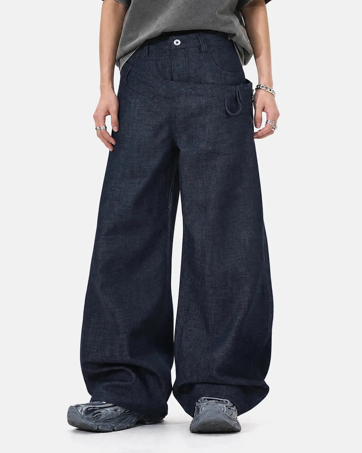 Inflation streetwear asymmetric wrap waist baggy jeans with relaxed fit and unique design, shown on a model.