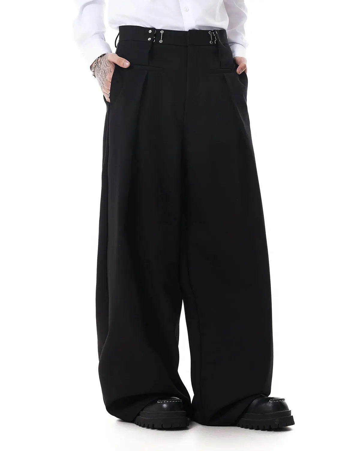Metal hook wide-leg suit pants by INFLATION, stylish trousers with a wide-leg fit and metal hook details, shown on a model.
