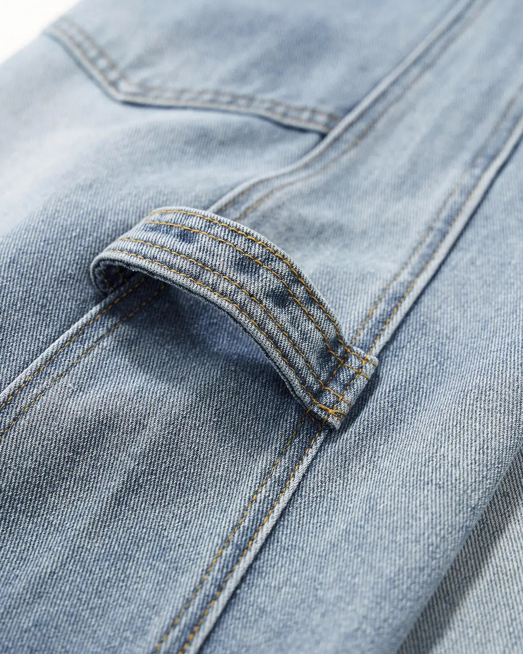 Distressed baggy cargo jeans by Flation featuring a relaxed fit, ripped details, multiple pockets, and a streetwear style.