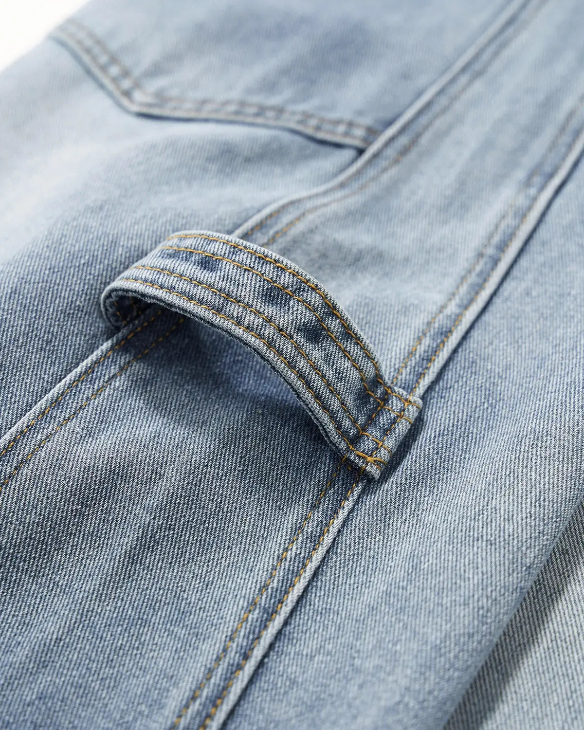 Distressed baggy cargo jeans by Flation featuring a relaxed fit, ripped details, multiple pockets, and a streetwear style.