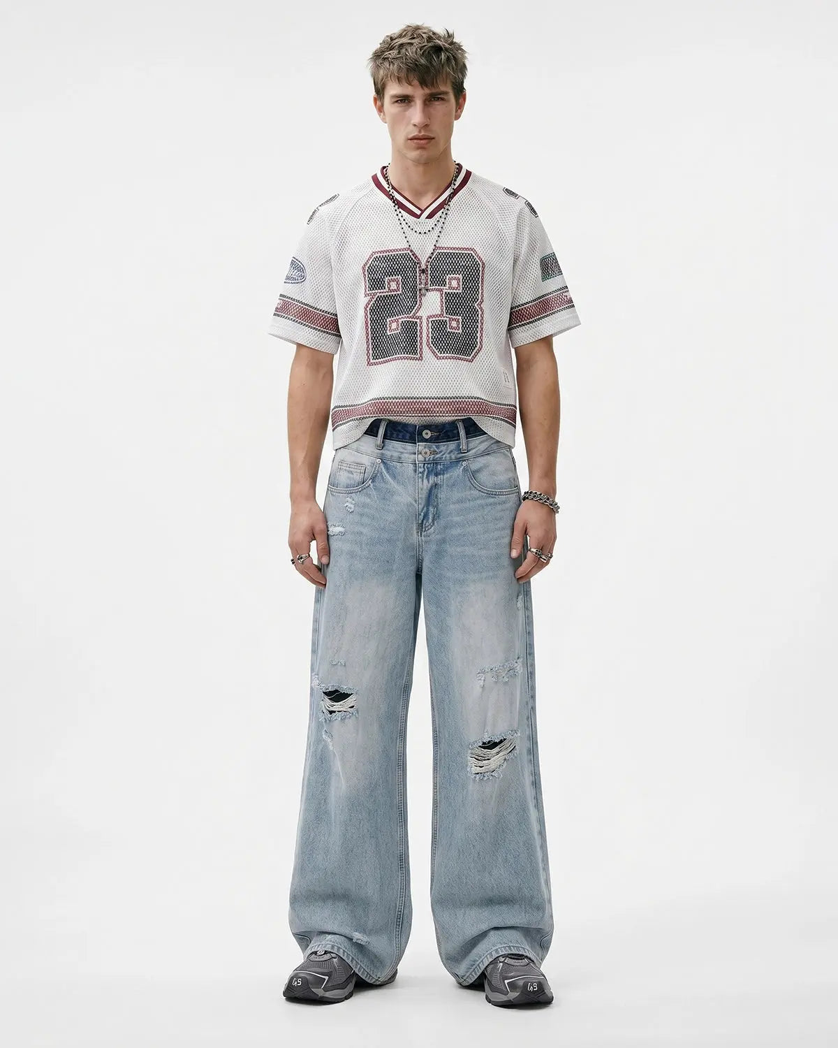 Distressed double waist baggy jeans by INFLATION Streetwear featuring relaxed fit and ripped details, casual streetwear style.