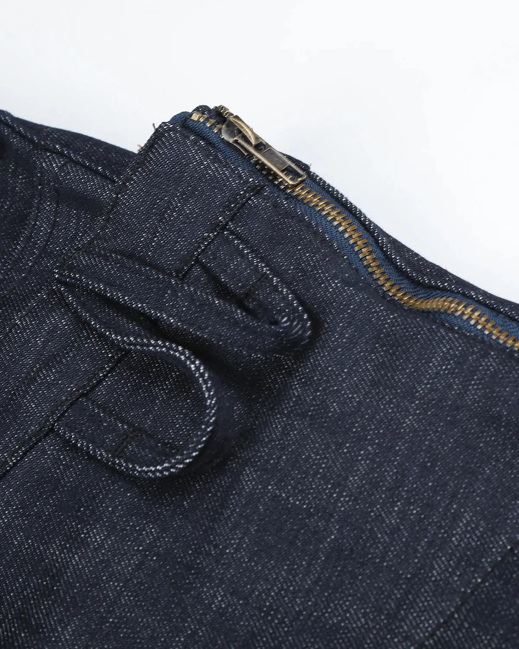 Inflation brand asymmetric wrap waist baggy jeans with loose fit and unique design, shown on model in a streetwear style.